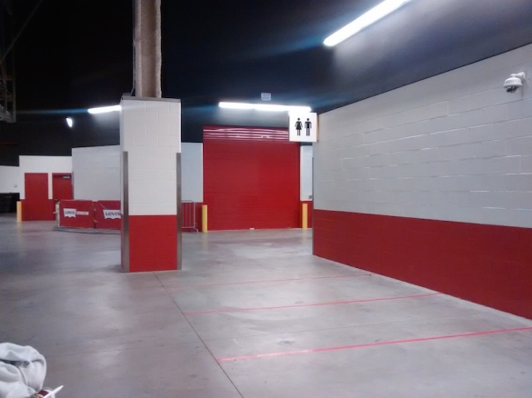 On the other side of the red rollup door is space for a 2nd home team locker room *cough* Raiders *cough*