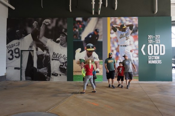 Fans walking in front of the clubhouse mural